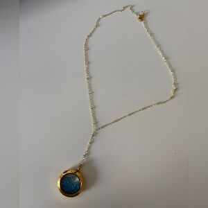 Elegant Gold Shaker Pendant Necklace with Aquamarine stones